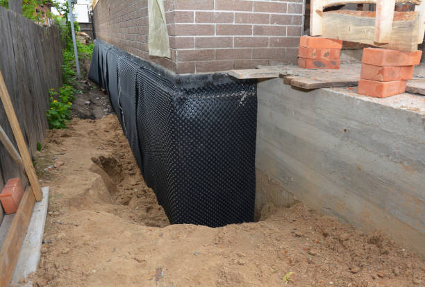 Happy homeowners after waterproofing job in Lake Odessa